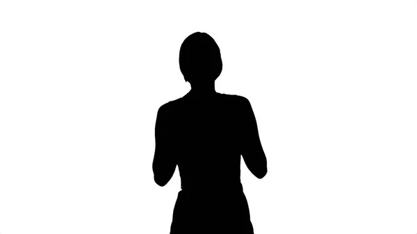 Silhouette Young beautiful woman holding cup of tea or coffee — Stock Photo, Image