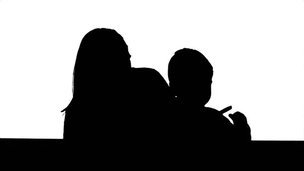 Silhouette Happy family mother and child painting together — Stock Photo, Image