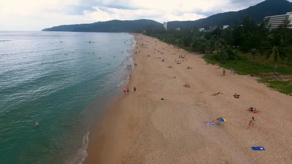 PHUKET, THAILAND - 20 JAN 2017: Flying over empty beach and few people walking and having sunbath on the beach — Stock Photo, Image