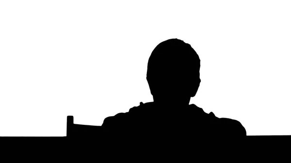 Silhouette A son drawing at the table at home — Stock Photo, Image