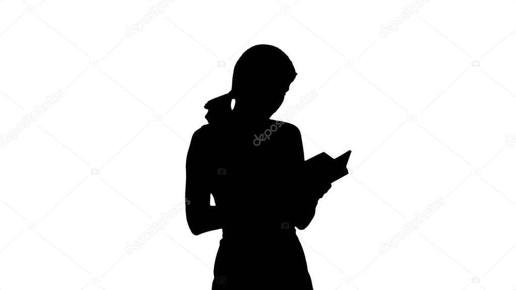 Silhouette Young girl with book on laptop 