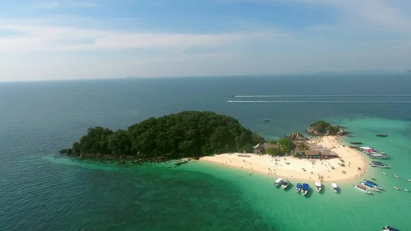 Beautiful fly over the wild island in Indian ocean, people swimming, yachts — Stock Photo, Image