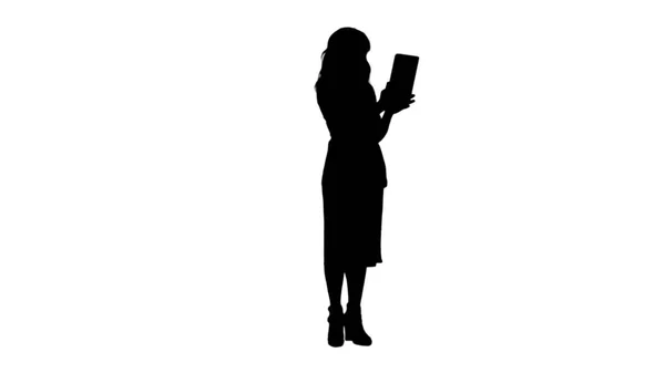 Silhouette Asian lady having video chat using a tablet track matte — Stock Photo, Image