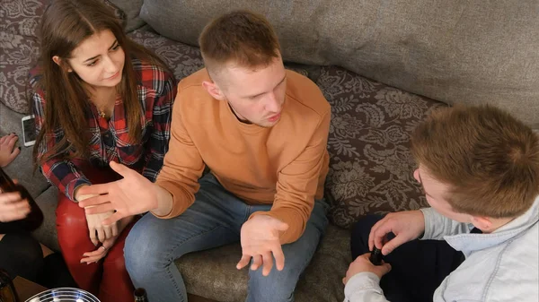 Student company talking and having fun while sitting on the couch — Stock Photo, Image