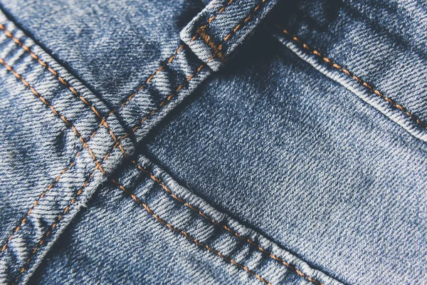 Modré džíny denim textury s odíráním a otvory. Abstraktní pozadí. — Stock fotografie