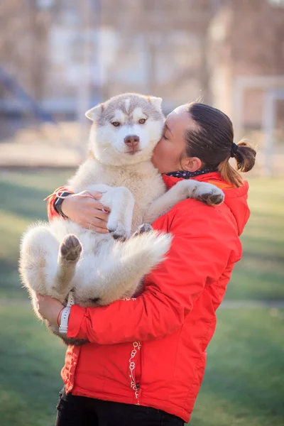 woman with puppy siberian husky