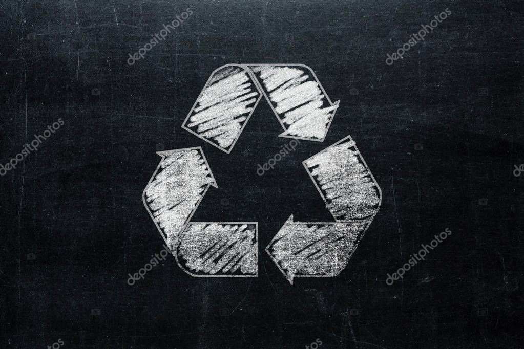 Recycle sign on chalkboard isolated on blackboard texture with chalk rubbed background from top view. Recycling infographic element