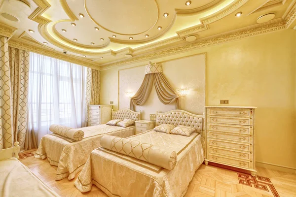 Luxurious interiors in a modern house.Designer modern renovation in a luxury house. Stylish bedroom interior with double bed.