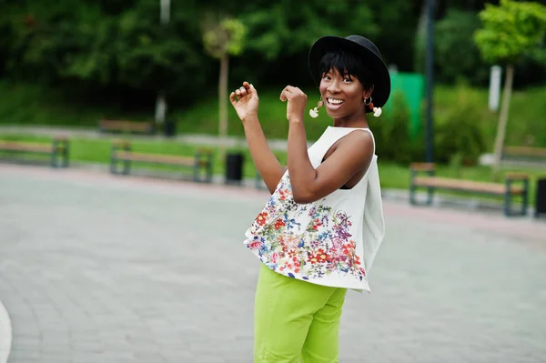 Amazing African American Model Woman Green Pants Black Hat Posed Stock Picture