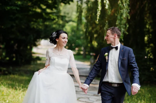 Gorgeous Wedding Couple Holding Hands Walking Park Sunny Day — Stock Photo, Image