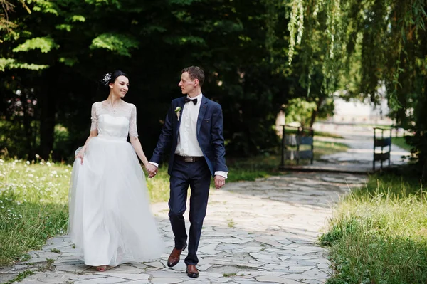 Gorgeous Wedding Couple Holding Hands Walking Park Sunny Day — Stock Photo, Image