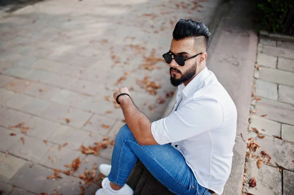 Stylish Tall Arabian Man Model White Shirt Jeans Sunglasses Sitting — Stock Photo, Image