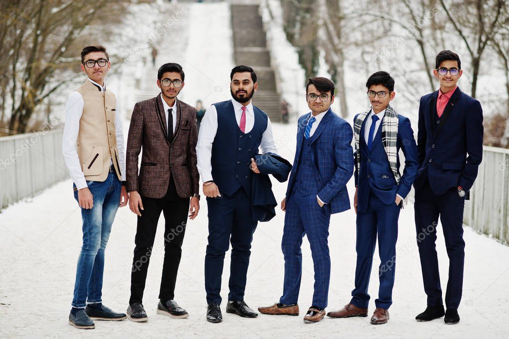 Group of six indian businessman in suits posed outdoor in winter day at Europe.