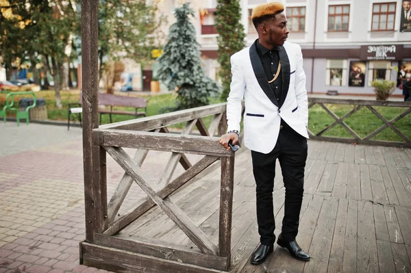 Chic handsome african american man in white suit.