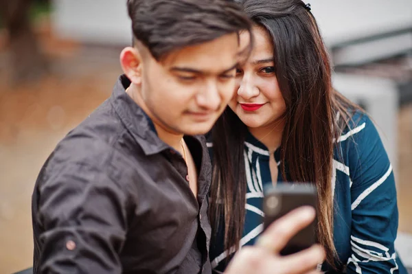 Indian Couple Posed Outdoor Sitting Bench Together Looking Mobile Phone — Stock Photo, Image