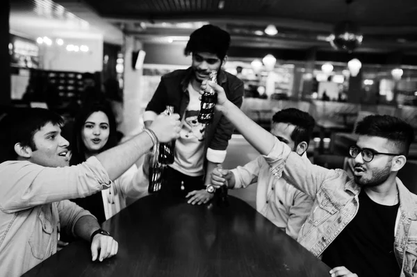 Group of stylish asian friends wear on jeans sitting at table an — Stock Photo, Image