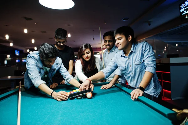 Group of stylish asian friends wear on jeans playing pool billia — Stock Photo, Image