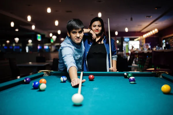 Stylish asian couple wear on jeans playing pool billiard on bar. — Stock Photo, Image