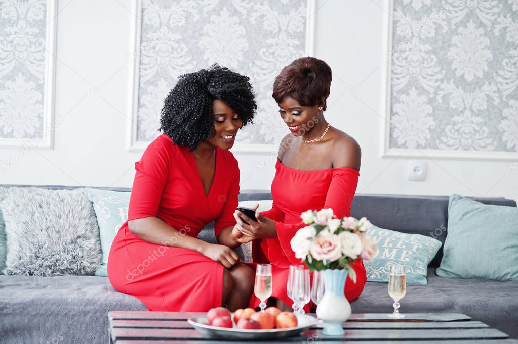 Two fashion african american models in red beauty dress, sexy wo