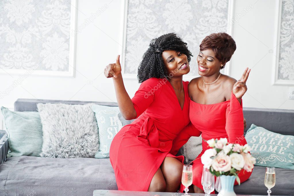 Two fashion african american models in red beauty dress, sexy wo