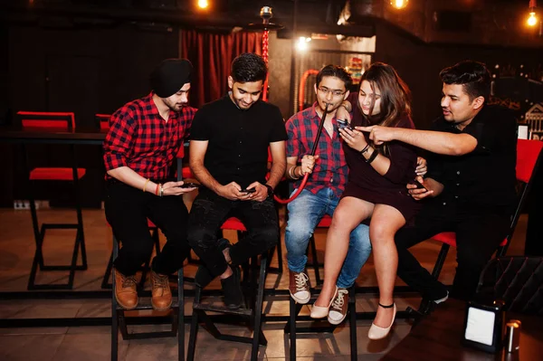 Group of indian friends sitting at lounge bar, having fun and re — Stock Photo, Image