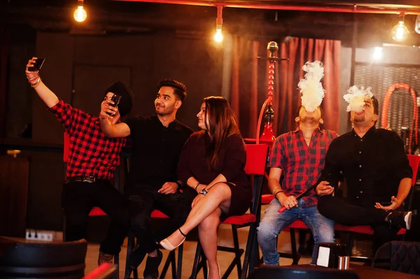 Group of indian friends sitting at lounge bar, having fun and re — Stock Photo, Image