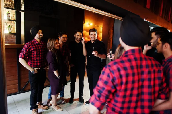 Group of indian friends having fun and rest at night club. They — Stock Photo, Image