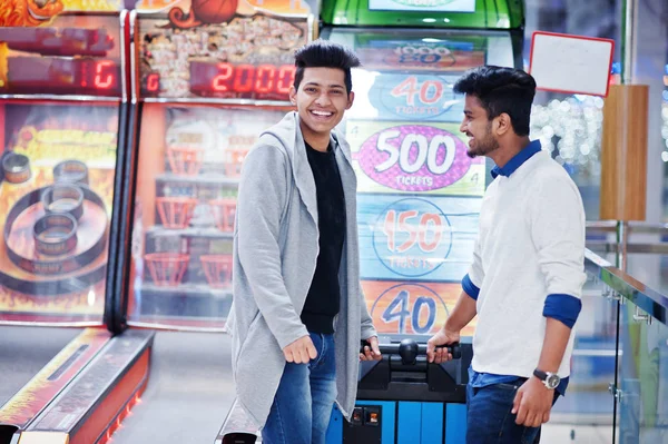 Two young asian guys play in fortune wheel to win at lottery big — Stock Photo, Image