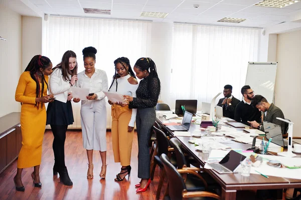 Diverse business people on a meeting at round table.