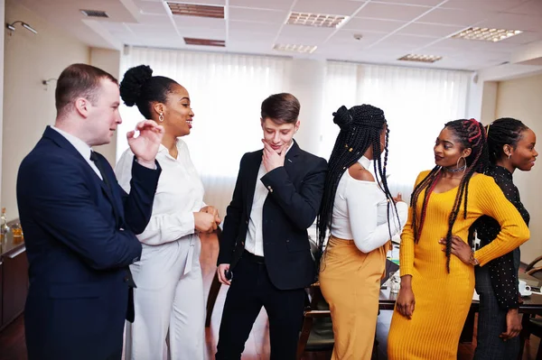 Multiracial business people standing at office and discuss toget