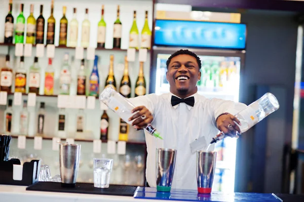 African american bartender working behind the cocktail bar. Alco