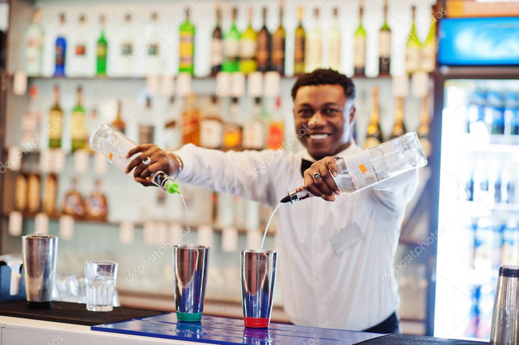 African american bartender working behind the cocktail bar. Alco