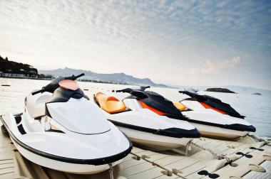 Three jet ski on a calm blue sea of Bodrum, Turkey. clipart
