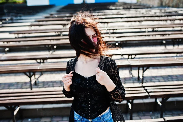 Portrait of brunette girl in pink glasses wear on black posed ou — Stock Photo, Image