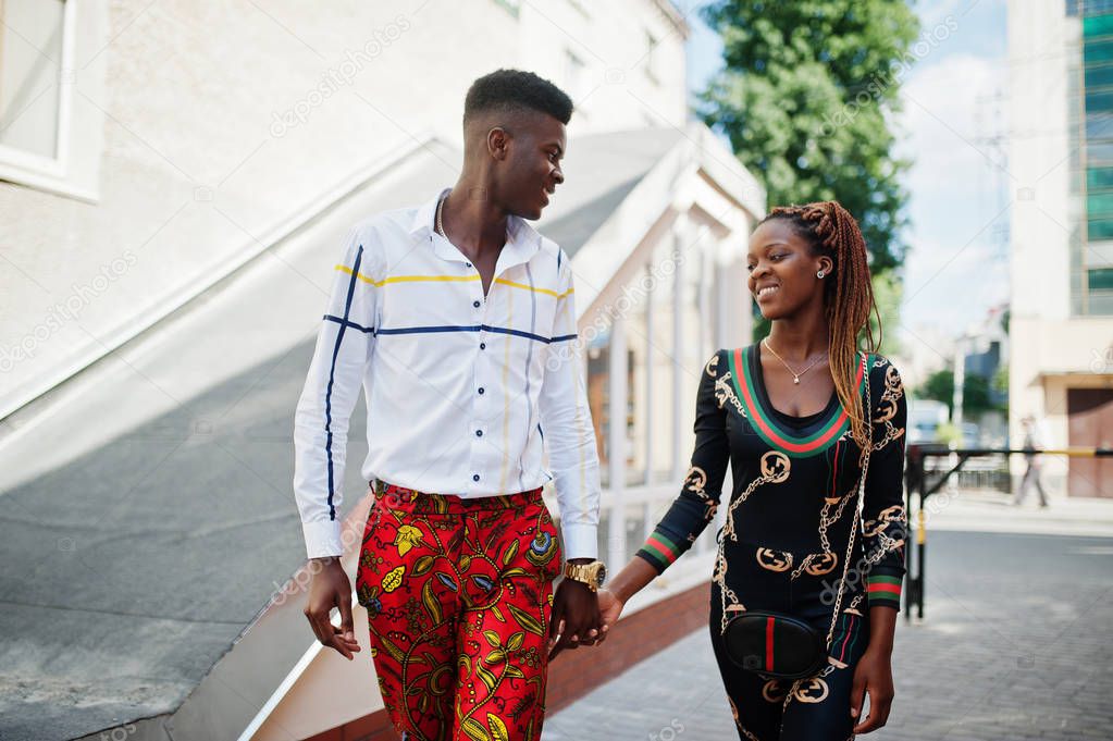 Handsome stylish african american couple posed at street togethe