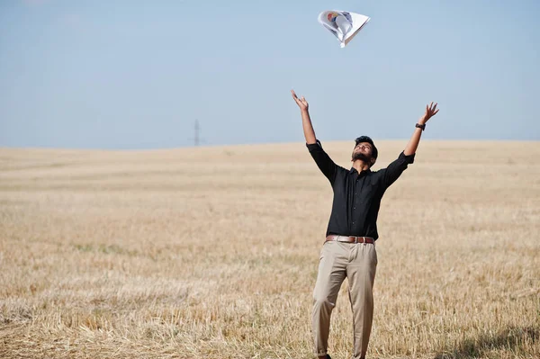 South asian agronomist farmer threw the papers into the sky at w