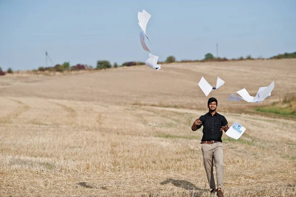 South asian agronomist farmer threw the papers into the sky at w
