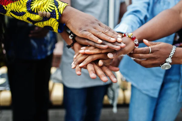 Group of five african college students spending time together on