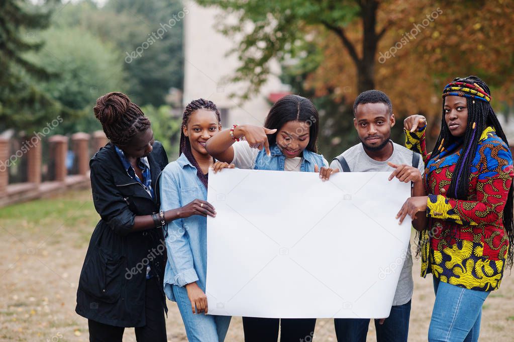 Group of five african college students on campus at university y