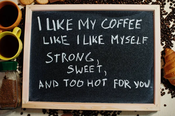 I like my coffee like i like myself. Strong, sweet, and too hot for you. Words on blackboard flat lay.