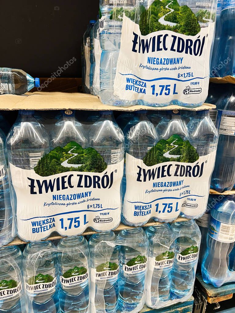 Tyczyn, Poland - August 22, 2025:  Sets of ywiec Zdrj bottled still water prominently displayed on a commercial store shelf