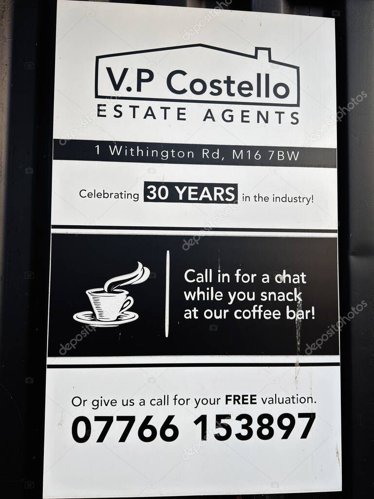 Manchester, UK - September 17, 2025: Signboard for a Manchester UK estate agent offering valuation, with coffee bar and chat.