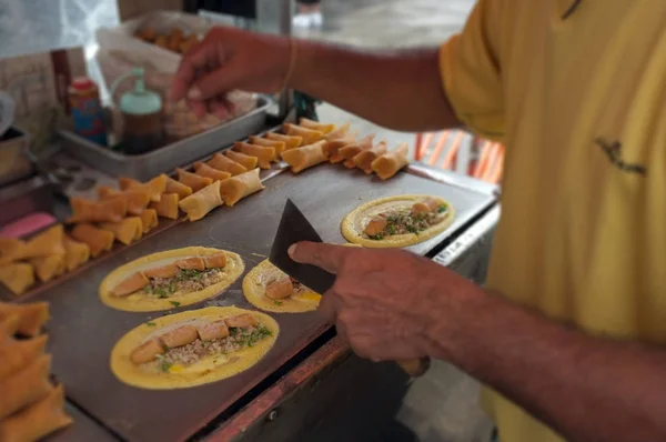 The man cooking Soft Waffle ,  Roll pancake stuffed with pork with custard and eeg ,Thai dessert. — Stock Photo, Image