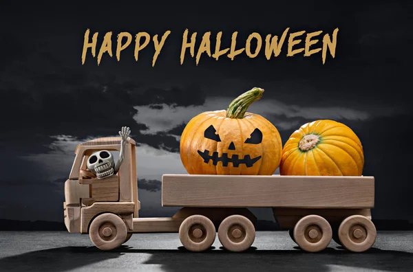 Halloween. In wooden toy car, scary holiday pumpkins, in cabin  skeleton of man. Gloomy black sky with clouds, shadows.