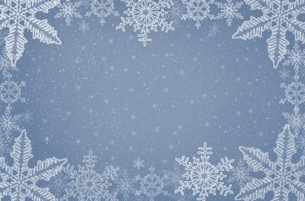 Mavi arka plan üzerinde Noel arka plan kar taneleri.