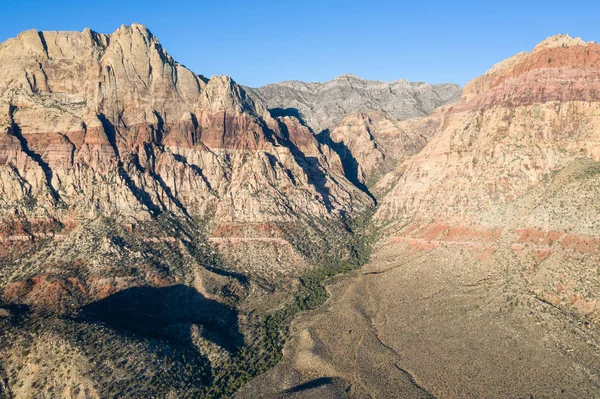 The Red Rock Canyon National Conservation Area, located just outside of Las Vegas, NV, is a showcase for massive red rock geologic formations. It is a popular hiking and rock climbing destination.
