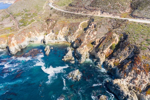 The nutrient-rich, cold waters of the North Pacific Ocean wash against the rocky and scenic coastline of Northern California not far from Monterey. Kelp forests thrive in this coastal environment.