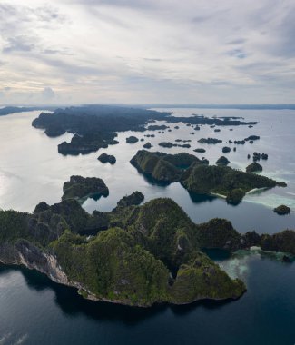 Seen from above, limestone islands stretch into the distance near Misool, Raja Ampat, Indonesia. This biodiverse region is known as the 