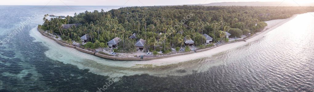 A remote resort is built on a idyllic island off the coast of Sulawesi in Indonesia. The Wakatobi resort is a favorite for scuba divers, snorkelers, and kite boarders due to its surrounding reefs and seasonal winds.