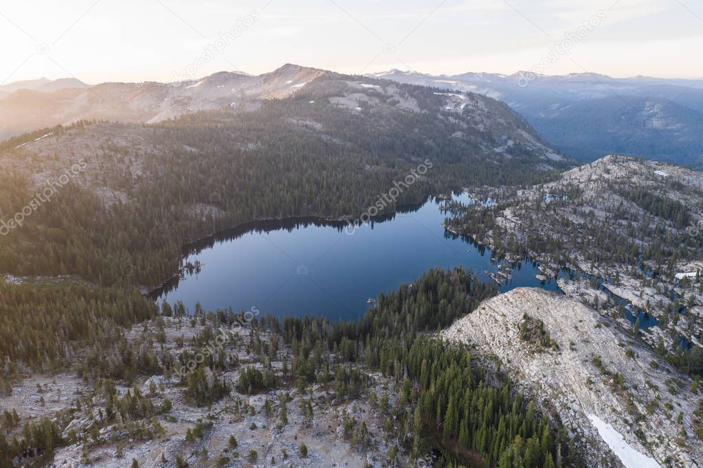 The Sierra Nevada mountains in California are made up of 100 million year old granite that were sculpted by glaciers. The mountain range includes 3 national parks and 20 wilderness areas.